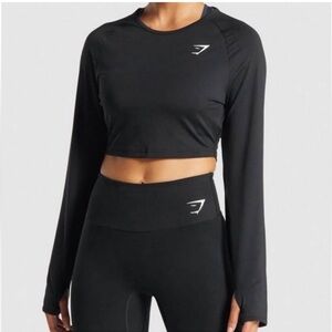 🌸 Gymshark Black Cropped Long Sleeve
Activewear Top 🌸